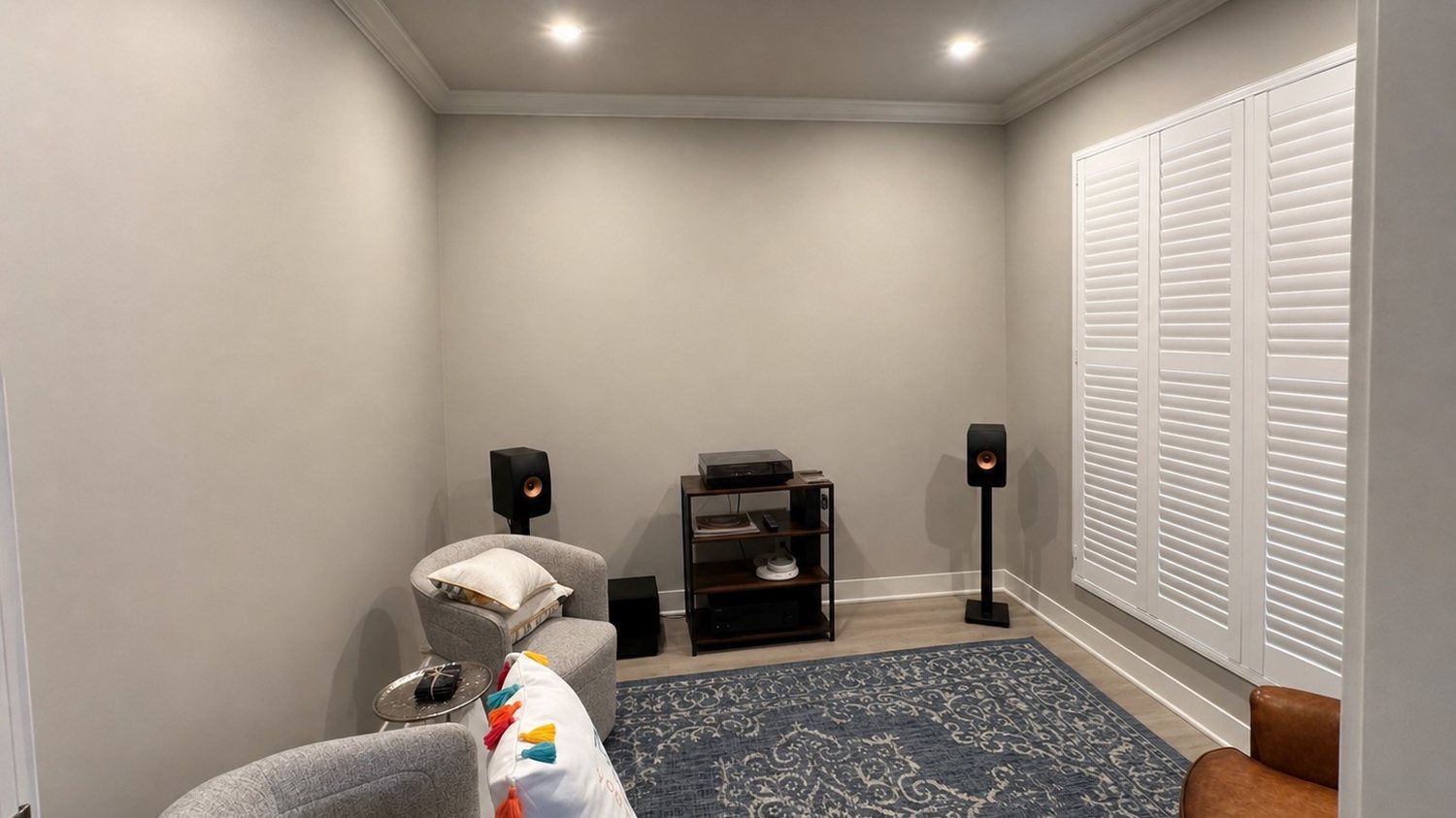 Media room before the Nelson Home & Company transformation, with bare walls and a bare floor
