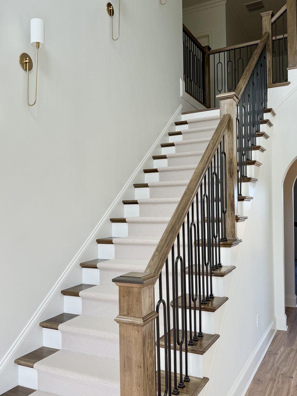 Staircase and two storey entry after the Nelson Home & Company transformation