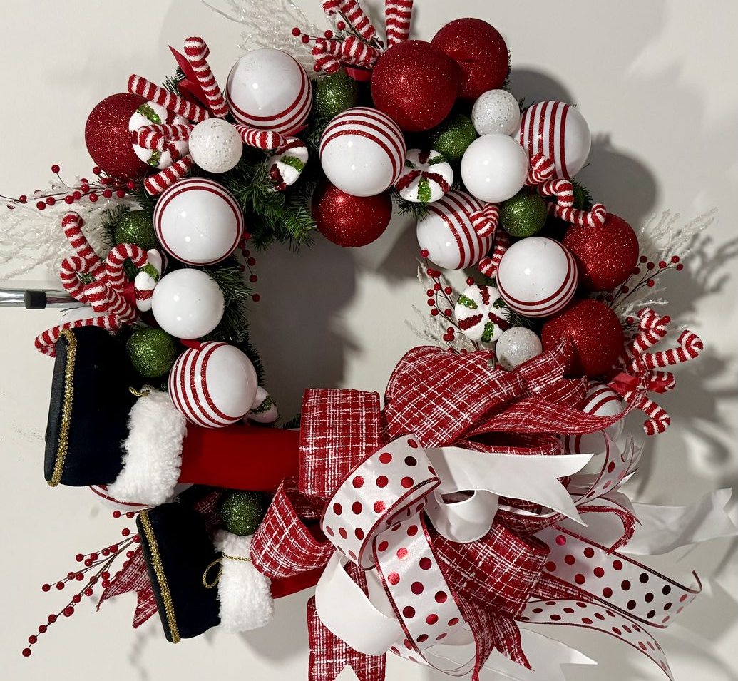 Christmas wreath in peppermint red and white with candy cane accents